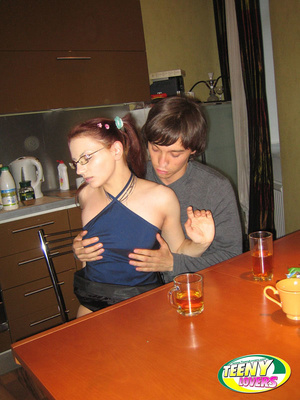 Pigtailed teen girl in glasses gets bent over and fucked on the table - Picture 4