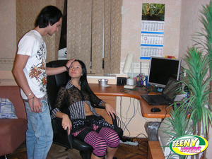 Brunette teen in striped leggings gives head at the computer - Picture 2