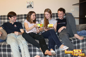 Girls enjoy fast food on a plaid couch before getting naked for their boyfriends who are looking to screw. - Picture 2