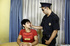 Police officer cuffs handsome teen and reads him his rights before making