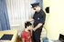 Police officer cuffs handsome teen and reads him his rights before making