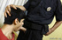 Male teen in a red tee obeys the law when officer commands him to deep-throat.