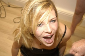 Cute blonde in lovely black dress wanking a group of big dicks before she sucks them and let them blow their spunk on her sweet face. - XXXonXXX - Pic 12