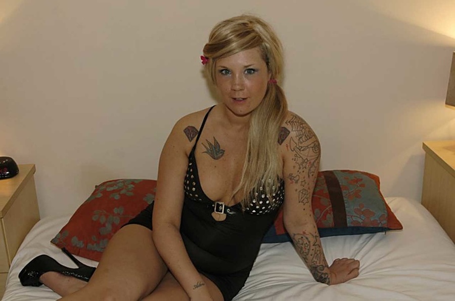 Tattooed babe in stunning black dress sucking multiple cocks and lets them squirt on her face before she lets a lovely brunette in black lingerie join the meat eating and bukkake party. - XXXonXXX - Pic 1