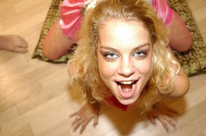 Cute curly blonde wearing pink nighty and fishnet stockings fits three hard cocks in her mouth while letting their cum drip on her tongue before she rides and bounces hard on a big dick on a white bed. - Picture 8
