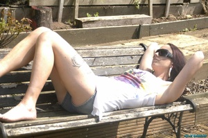 Gorgeous brunette with sunglasses displays her sexy body wearing her white floral shirt and mini jeans shorts outdoor before she goes inside and kneels down then lets a bunch of cocks slap her face before she sucks them and gets a warm facial. - XXXonXXX - Pic 1