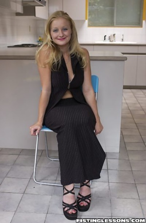Classy blonde poses in a pristine kitchen before mounting the counter for self-fisting. - Picture 1