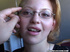Gallant girl in glasses is given a cum facial after fisting her vagina