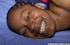 Ebony in a blue bed gets her holes stuffed by her fetching fair-skinned