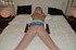 Slutty blonde is on her stomach and tied to her bed when wearing sheer