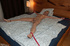Hot, slender blonde with a puffy pussy is tied to her bed at her wrists