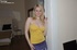 Blonde with blue eyeshadow and white lace-top tights is tethered to a