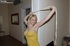 Blonde with blue eyeshadow and white lace-top tights is tethered to a