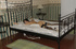 Blonde in sheer pantyhose is hogtied in bed while resting her head on