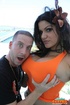 Sweet brunette with big ass and tits in orange top takes dick in mouth
