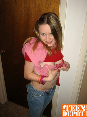 Cute teen hottie takes off her pink and red sweater and blue jeans then bares her skinny body and hot ass before she removes her pink and white thong and rubs her pussy in different positions by a door. - XXXonXXX - Pic 5