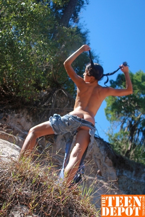 Topless young hottie wearing pigtails loves to pose on a rocky mountain with her petite tits exposed then she takes off her ripped jeans then spreads her legs and shows her sweet pussy outdoor. - XXXonXXX - Pic 6