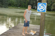 Teen gay takes off his gray shirt and blue shorts then wanks his cock in different positions as he jerks off by the dock til he releases warm spunk.