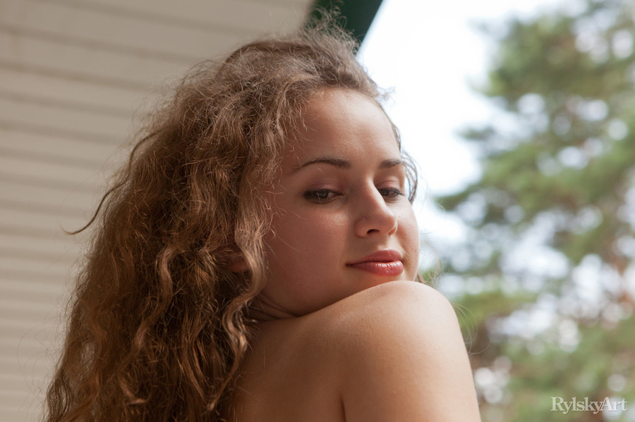 Sweet young babe with curly brown hair sits - XXX Dessert - Picture 15