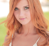 Green-eyed goddess with long hair sheds her white dress outside while