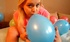 Blonde preggo inflating balloons and posing
