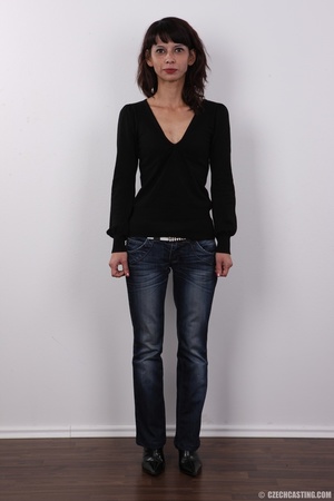 Skinny brunette in black blouse, blue je - Picture 2