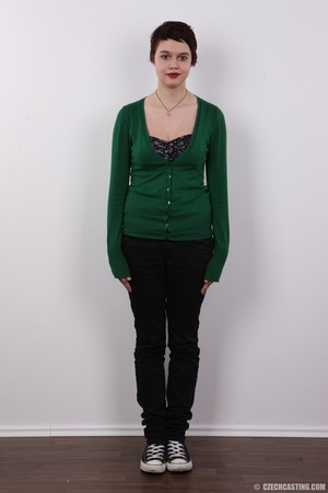 Short haired brunette wearing green blou - Picture 2