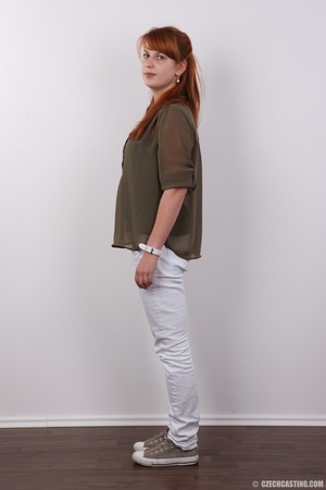 Cute redhead peels off her green blouse, - Picture 3