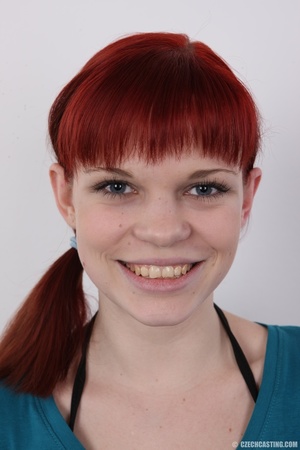Cute redhead in pony tail displays her p - Picture 1