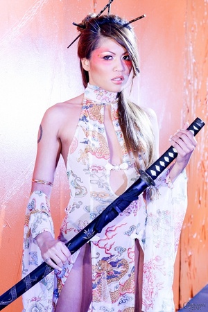Desirable minx in a sheer sexy dress poses with a Japanese sword. - XXXonXXX - Pic 3