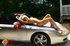 Cute blonde in white hats and skirt, plus red lingerie plays with dildo