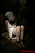 Brunette in a white dress and black fishnets gets groped in her cell.