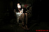 Brunette in a white dress and black fishnets gets groped in her cell.