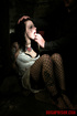 Brunette in a white dress and black fishnets gets groped in her cell.