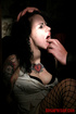 Brunette in a white dress and black fishnets gets groped in her cell.