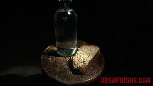 Dark-haired doll in black fishnets asked to eat bread and made to drink water. - Picture 1