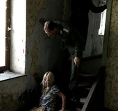 Dame in a blue dress gets her panties fed to her by some guards.