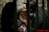 Dame in a blue dress gets her panties fed to her by some guards.