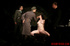 Bare gal tied to a chair gets slapped around by her interrogators.