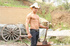 Hunk cowboy wearing brown hat and blue jeans seduces a gay stud lying