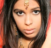 Beautiful Indian chick posing in her pink hijab before she expose her