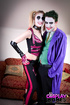 Two geek bitches in cosplays pleasing a dude looking like Joker