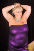 Mature blonde displays her huge body in violet dress strips off and bares