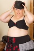 Blonde babe with huge body posing wearing her black hat, bra, and her