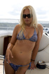 Blonde is excitingly bending her steaming body on the yacht and fucking