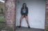 Brunette with mouthwatering tits is hotly posing outdoors and peeing