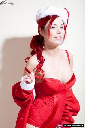 Lovely redhead wearing red santa hat, jacket, nighty and stockings peels them off piece by piece and displays her luscious tits and clean shaved pussy. - XXXonXXX - Pic 9