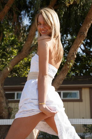 Mischievous blonde freshie in a white dr - Picture 2