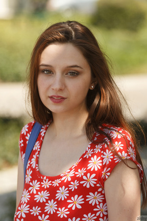 Lovely brunette teen in a red floral dre - Picture 1