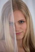 Arousing long-haired blonde freshie fingering her tiny pussy